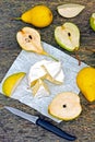 Pears and camembert cheese on a wooden surface. Royalty Free Stock Photo