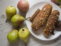 Pears and creampuffs on wooden background Royalty Free Stock Photo