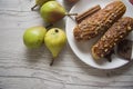 Pears and creampuffs on wooden background Royalty Free Stock Photo