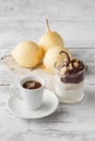 Pears in dark chocolate, sweet dessert set with modern copper co