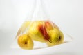 Pears in a plastic bag with water on a white background. Royalty Free Stock Photo
