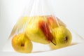 Pears in a plastic bag with water on a white background. Royalty Free Stock Photo