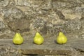 Pears on a stone wall