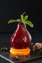 Pears in wine. Traditional dessert pears stewed in red wine on b