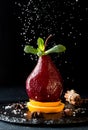 Pears in wine. Traditional dessert pears stewed in red wine on b
