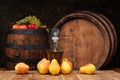 Pears, wooden barrel and the brandy bottle