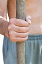 Peasant holds old wooden tool handle Royalty Free Stock Photo