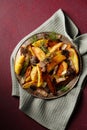 Potatoes with wild mushrooms morels seasoned with chili, garlic and greens