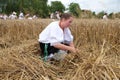 Peasant woman harvesting wheat