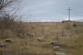 Peasant wooden cross on the mountain near the river bank, lake. Royalty Free Stock Photo