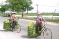 Peasants in bike Royalty Free Stock Photo