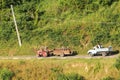 Peasants transported on tractor and truck trailer in Trinidad