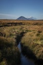 Peat bog in Ireland, with Slievemore mountain. Royalty Free Stock Photo