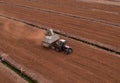 Peat Harvester Tractor on Collecting Extracting Peat. Mining and harvesting peatland. Area drained of the mire are used for peat