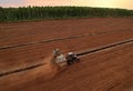 Peat Harvester Tractor on Collecting Extracting Peat. Mining and harvesting peatland. Area drained of the mire are used for peat