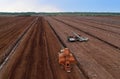 Peat Harvester Tractor on Collecting Extracting Peat. Mining and harvesting peatland. Area drained of the mire are used for peat