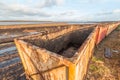 Peat mining area with old empty cart in the foreground