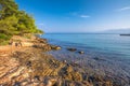 Pebble beach on Brac island with turquoise clear ocean water, Supetar, Brac, Croatia Royalty Free Stock Photo