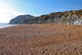 The pebble beach at the the English town of Seatown in Dorset on the Jurassic coast between Charmouth and West Bay Royalty Free Stock Photo