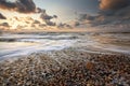 Pebble beach at sunset Royalty Free Stock Photo