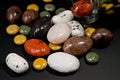 Pebble-dragee with apricots, chocolate, mandarin and marzipan