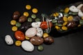 Pebble-dragee with apricots, chocolate, mandarin and marzipan