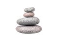 Pebble pile on white background isolated close up, stack of balanced zen stones, smooth sea pebbles pyramid, cobblestones tower Royalty Free Stock Photo