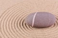 Pebble in a raked sand circle Royalty Free Stock Photo