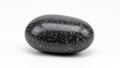 Pebble rests on a plain white background emphasizing its natural colors and Royalty Free Stock Photo