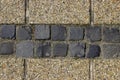 Pebble shingle cobblestone sidewalk background or texture.