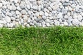 Pebble stone and green grass Royalty Free Stock Photo