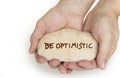 Pebble stone in hands. Concept for a be optimistic sign Royalty Free Stock Photo