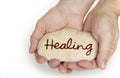 Pebble stone in hands. Concept for healing sign Royalty Free Stock Photo