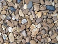 pile of brownish pebble stone texture background