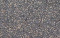 Pebble stones background, dark gravel texture close up