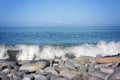 Pebble stones on the shore close up in the blurry distance background. Natural background Royalty Free Stock Photo