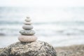 Pebble tower balance harmony stones arrangement on sea beach coastline peaceful formation pyramid Royalty Free Stock Photo