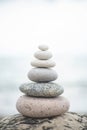 Pebble tower balance harmony stones arrangement on sea beach coastline peaceful formation pyramid