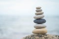 Pebble tower balance harmony stones arrangement on sea beach coastline peaceful formation pyramid