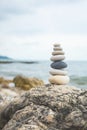 Pebble tower balance harmony stones arrangement on sea beach coastline peaceful formation pyramid Royalty Free Stock Photo