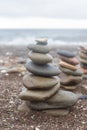 Pebble tower balance harmony stones arrangement on sea beach Royalty Free Stock Photo