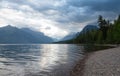 Pebbled Beach of Lake McDonald in Glacier National Park, Montana with Mountains in Background Royalty Free Stock Photo