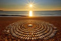 pebbles arranged into a giant sun motif on a sunny beach