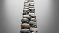 Pebbles arranged in two parallel rows create a visually pleasing pattern Royalty Free Stock Photo