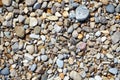 Pebbles on the beach. Smooth stones of various sizes and colors. Top view