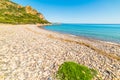 Pebbles and blue sea in Baccu e Praidas beach, Royalty Free Stock Photo