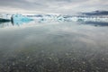 Pebbles and clear waters at famous ice lagoon, Jokulsarlon, Iceland