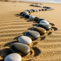 By the pebbles create a textured pattern on the sand, which shows faint Royalty Free Stock Photo