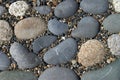 Background of smooth flat pebbles and gravel.