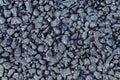 Pebbles on freshly laid asphalt. Royalty Free Stock Photo